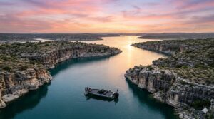 Angler Lipping Bass on Skeeter Boat Lake Amistad at Dawn Aerial